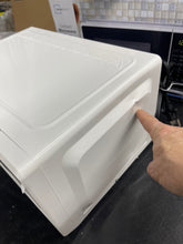 Mainstays 0.7 Cu ft Countertop Microwave Oven, 700 Watts, White**New, minor dent from shipping**