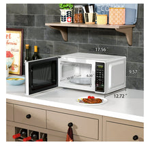 Mainstays 0.7 Cu ft Countertop Microwave Oven, 700 Watts, White**New, minor dent from shipping**