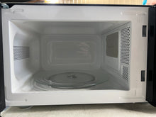Mainstays 0.7 Cu ft Countertop Microwave Oven, 700 Watts, Black!! USED ONCE, VERY CLEAN!!