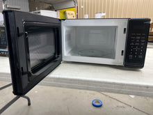 Mainstays 0.7 Cu ft Countertop Microwave Oven, 700 Watts, Black!! USED ONCE, VERY CLEAN!!