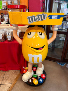 M&M Yellow Character Candy Store Display w/ Storage Tray 

Rolling Wheels

(47” tall) 

used condition