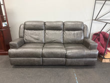 GRAY LEATHER POWER RECLINING SOFA WITH POWER HEADRESTS!! (DEPARTMENT STORE RETURN)