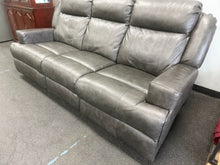 GRAY LEATHER POWER RECLINING SOFA WITH POWER HEADRESTS!! (DEPARTMENT STORE RETURN)