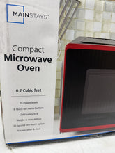 Mainstays 0.7 Cu ft Capacity Countertop Microwave Oven, Red!! NEW IN BOX!!