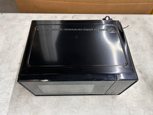 Mainstays 0.7 Cu ft Compact Countertop Microwave Oven, Black!! NEW OUT OF BOX(DENT FROM SHIPPING)!!