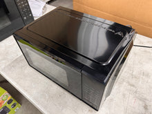 Mainstays 0.7 Cu ft Compact Countertop Microwave Oven, Black!! NEW OUT OF BOX(DENT FROM SHIPPING)!!