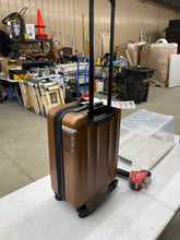 Make traveling effortless and stylish with this 20” Skyline Hardside Carry-On Spinner Suitcase in stylish bronze.