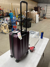 Skyline Hardside Carry-On Spinner Suitcase in stylish purple