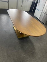 Gorgeous and unique solid wood dining table with massive fabricated brass finish steel base.