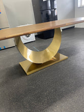 Gorgeous and unique solid wood dining table with massive fabricated brass finish steel base.