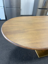 Gorgeous and unique solid wood dining table with massive fabricated brass finish steel base.