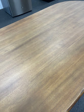 Gorgeous and unique solid wood dining table with massive fabricated brass finish steel base.