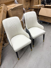 Check out this beautiful pair of brand new modern dining chairs — stylish, comfortable, and priced to MOVE!  No shipping