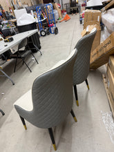 Check out this beautiful pair of brand new modern dining chairs — stylish, comfortable, and priced to MOVE!  No shipping
