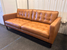 Harstine Leather Sofa! (NEW - CUSHION HAS PULLED THREAD)