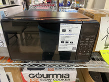 Mainstays 0.7 Cu ft Countertop Microwave Oven, 700 Watts, Black!! LIGHTLY USED, MINOR SCRATCH & DENT!!