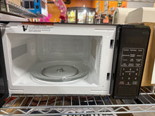 Mainstays 0.7 Cu ft Countertop Microwave Oven, 700 Watts, Black!! LIGHTLY USED, MINOR SCRATCH & DENT!!