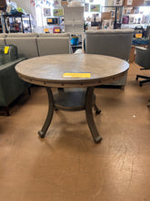 Powell Company
Terran Brown 45" Round Dining Table with Shelf and Oak Woodgrain Veneer**New and assembled, chipped from shipping**