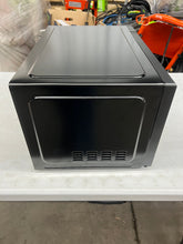 Mainstays 1.1 Cu ft Microwave Oven, Black!! NEW OUT OF BOX(MINOR DENT FROM SHIPPING)!!