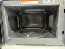 Mainstays 1.1 Cu ft Microwave Oven, Black!! NEW OUT OF BOX(MINOR DENT FROM SHIPPING)!!