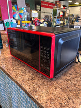 Mainstays 0.7 Cu ft Capacity Countertop Microwave Oven, Red! (NEW OUT OF BOX)